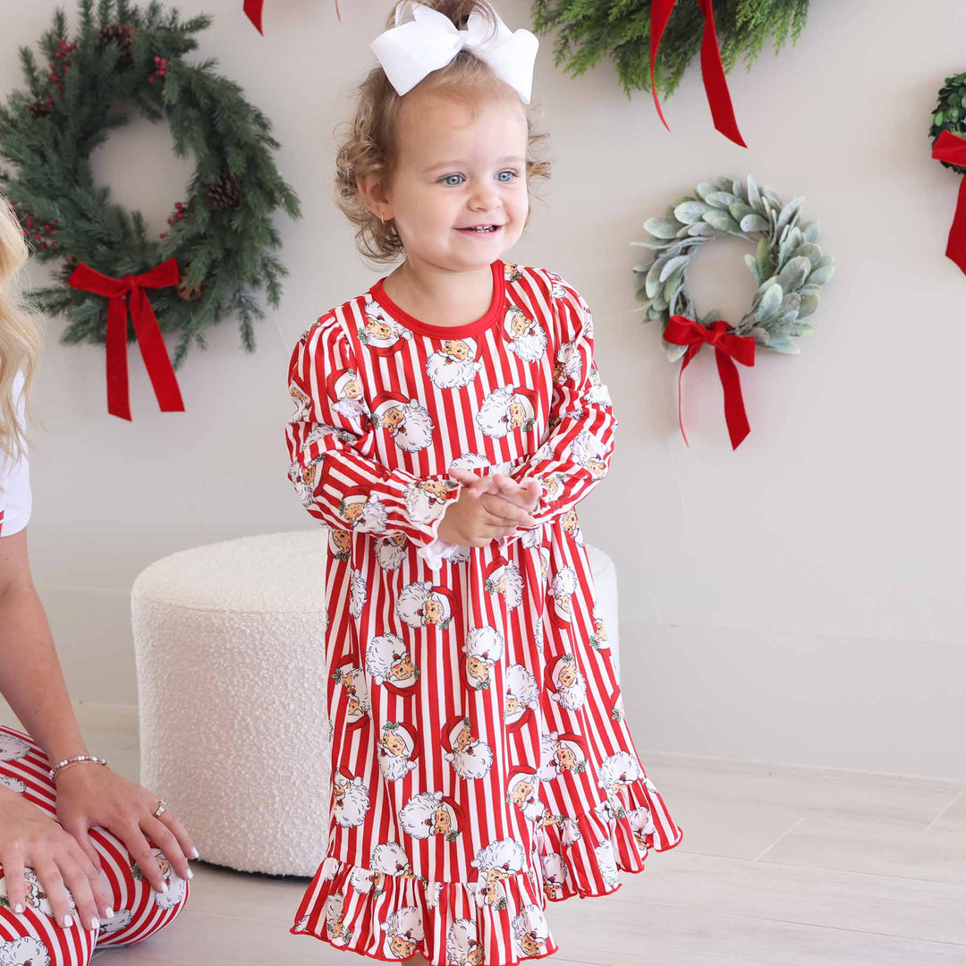 Little girl wearing the Santa Claus Lane Long Sleeve Nightgown