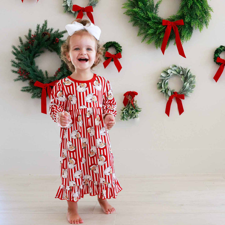Little girl wearing the Santa Claus Lane Long Sleeve Nightgown