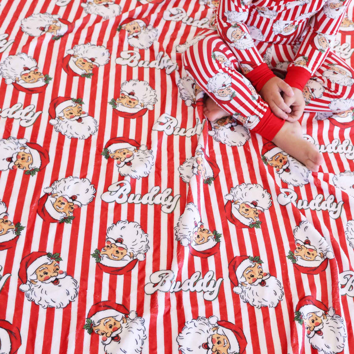 Santa Claus Lane Personalized Kids Blanket with baby wearing matching onesie