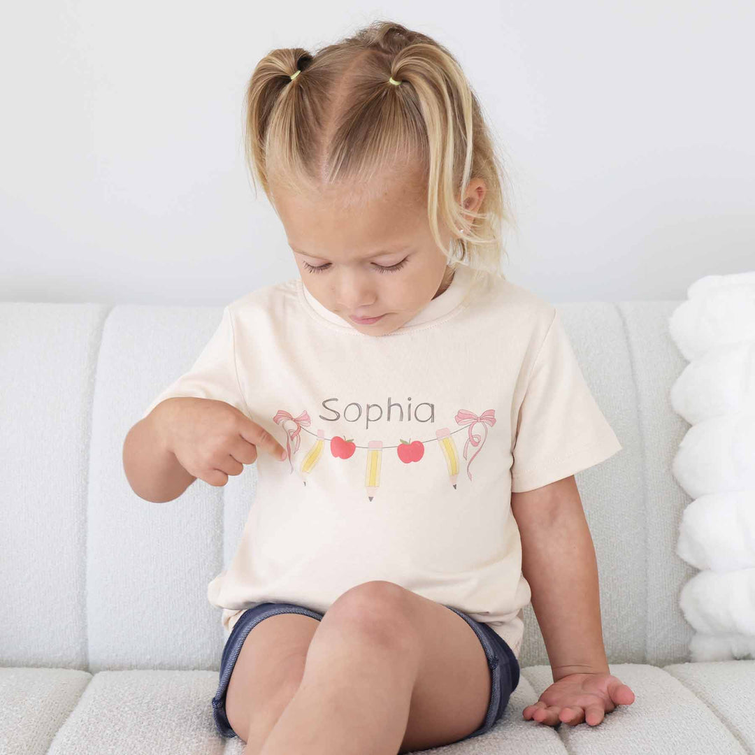 bow, pencil and apple garland graphic tee for kids 