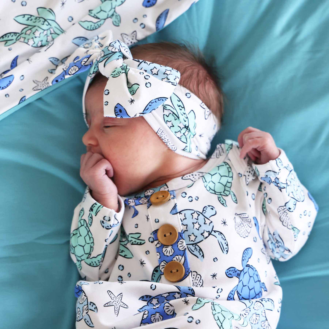 blue and green knit large bow headwrap for babies and newborns 