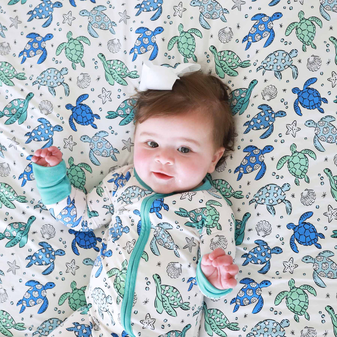 blue and green sea turtle convertible zip romper pajama for babies and toddlers