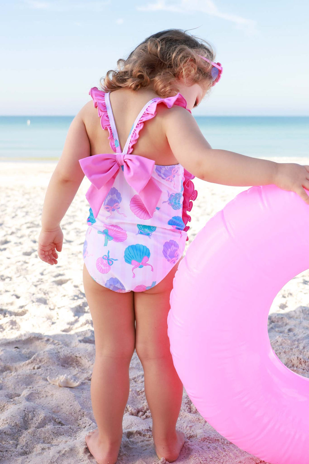 back view of seaside sweetie double ruffle one piece swimsuit