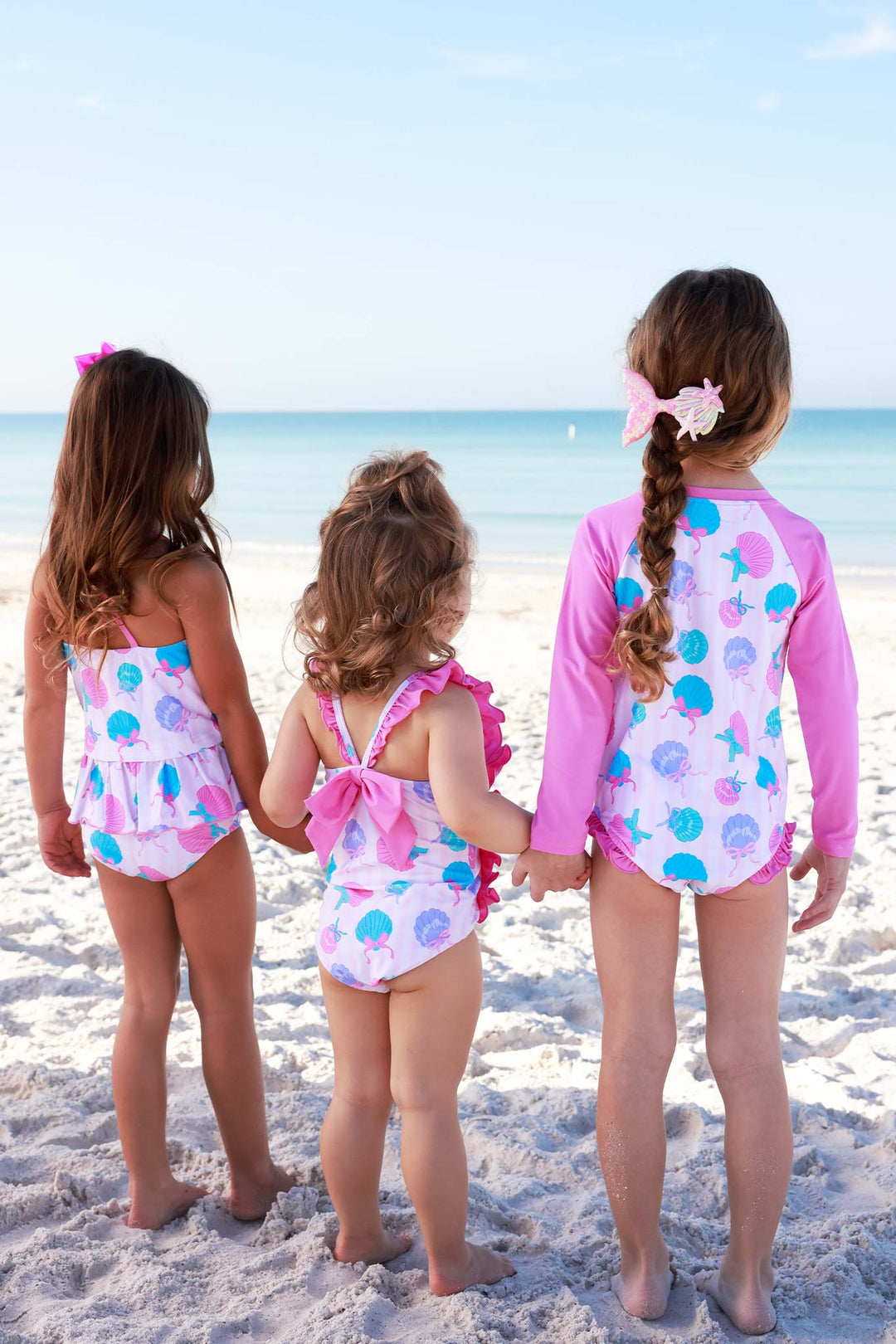 back view of seaside sweetie seashell sibling matching swimsuits 