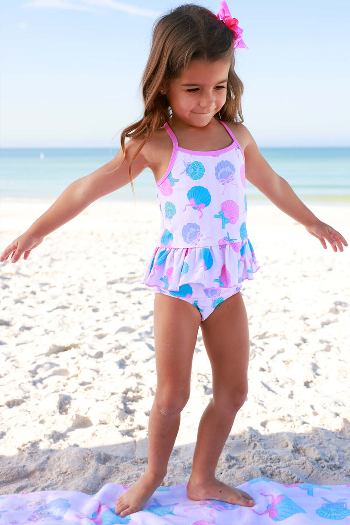 girl standing on towel on beach in seaside sweetie tankini