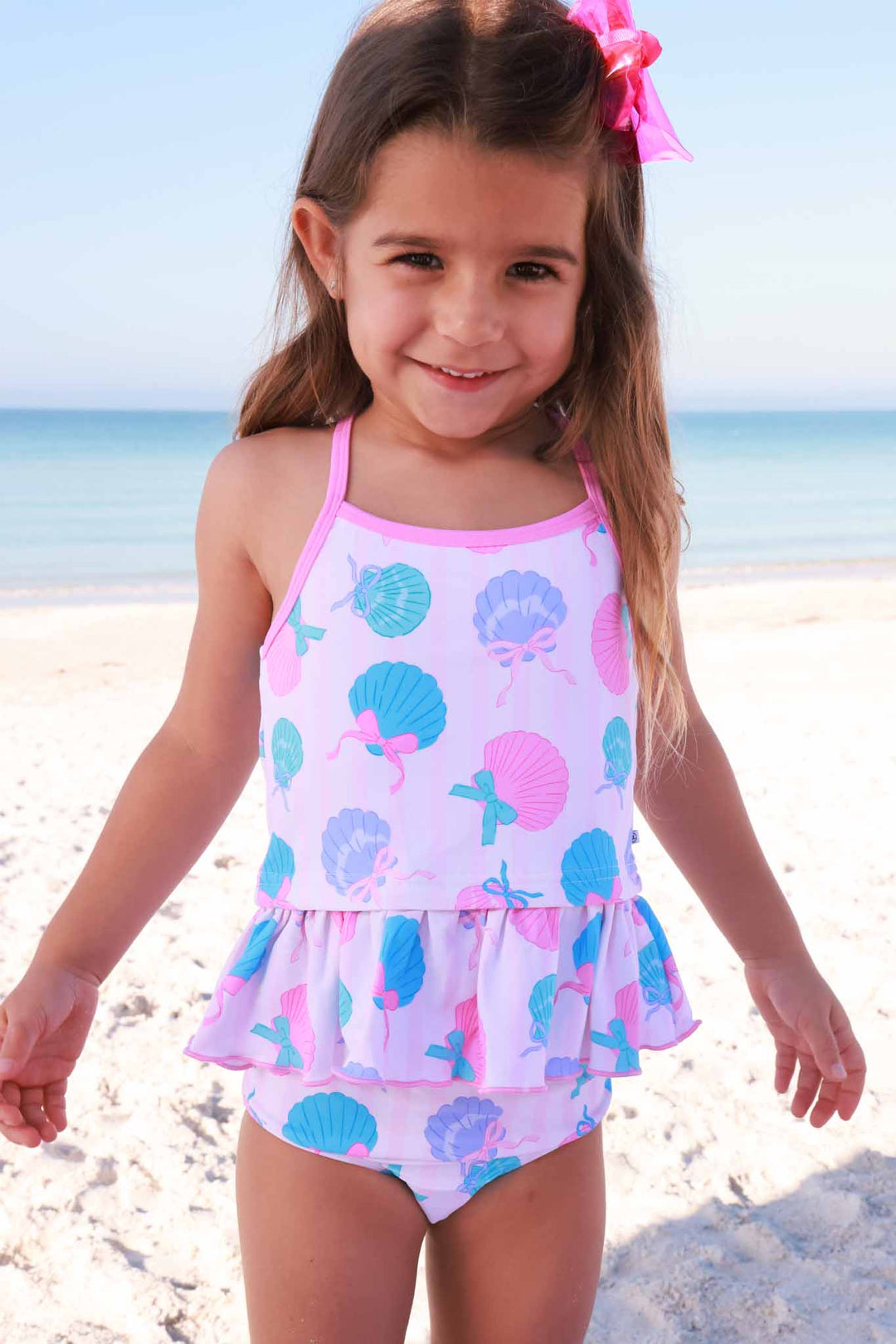 girl standing on the beach in strappy two piece tankini in seaside sweetie 