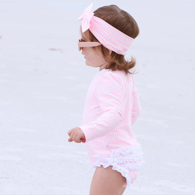 pink and white ruffle bottom swimsuit for babies
