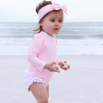pink seersucker rash guard swimsuit for babies and toddlers 