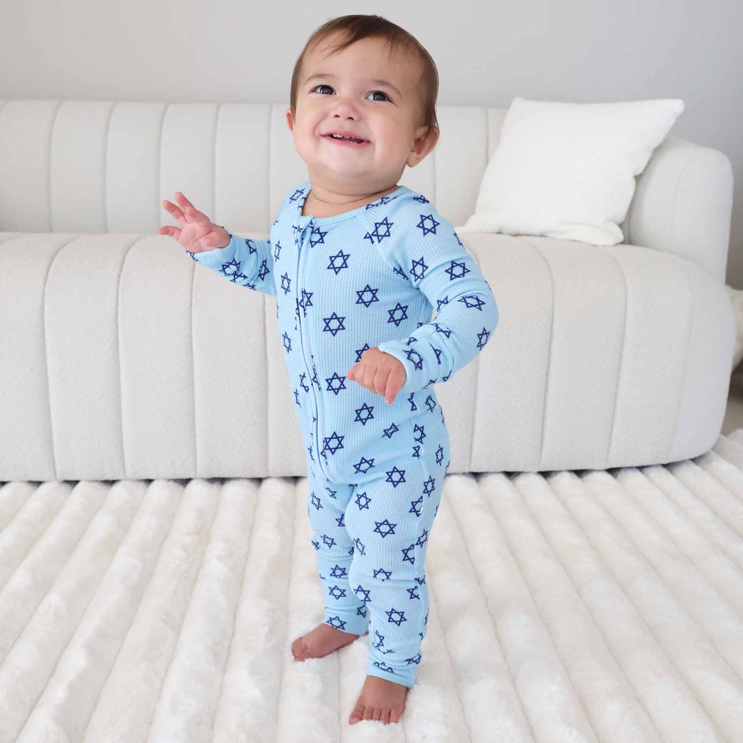 toddler boy wearing star of david hanukkah pajamas 