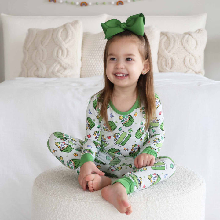 green cake and cupcake long sleeve and pant two piece pajama set with bright green trim and cuffs