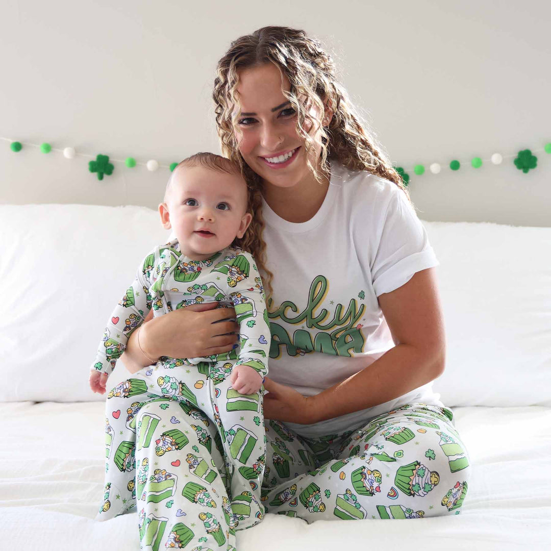 mom holding baby wearing matching shamrock sweets st. patrick's day pajamas
