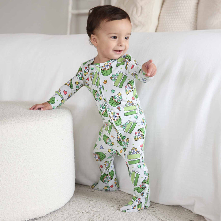 baby boy standing wearing shamrock sweet baby footie 