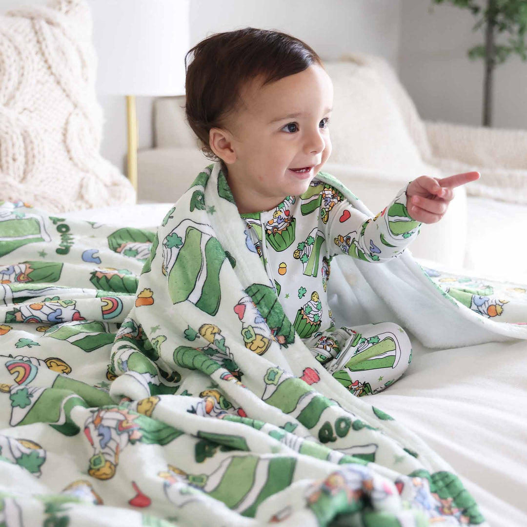 green st. patrick's day personalized blanket for kids with sweets on it