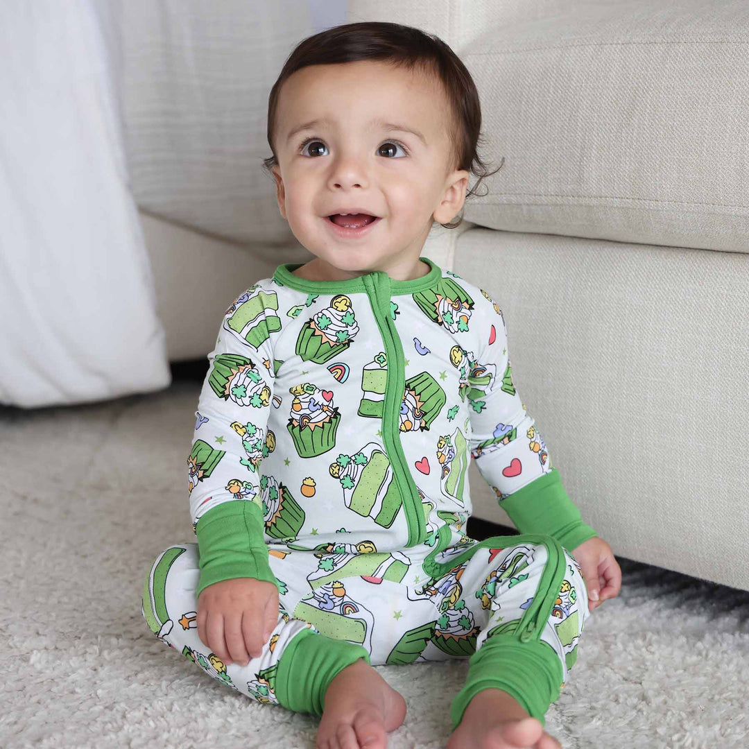 baby boy wearing the shamrock sweets zip romper pajama 