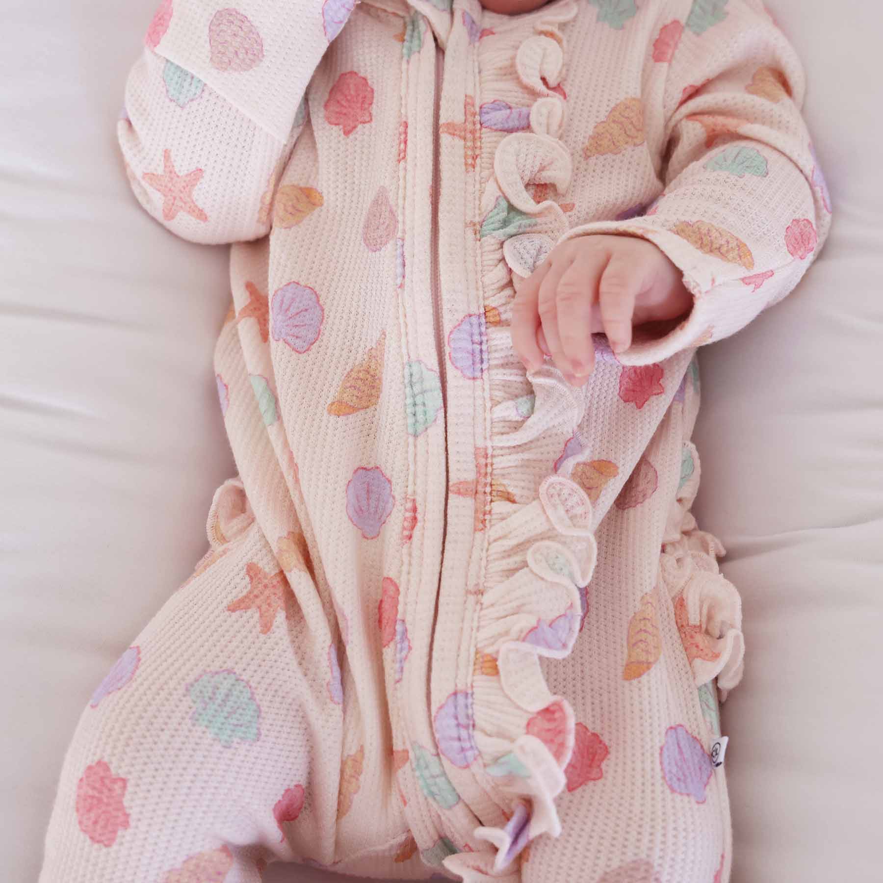Saltwater Shells Bamboo Waffle Zipper Ruffle One-Piece Footie | Caden Lane