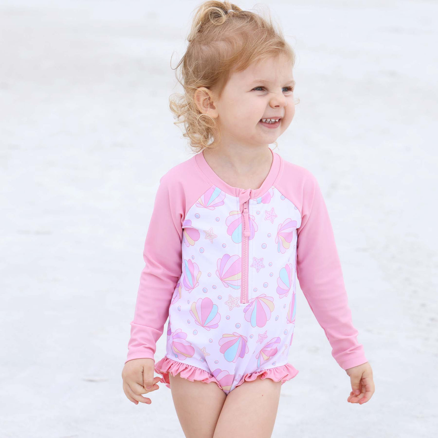 baby swimsuit with pink seashells and long sleeve