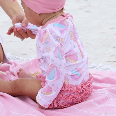 pink seashell long sleeve rash guard with ruffle bottom