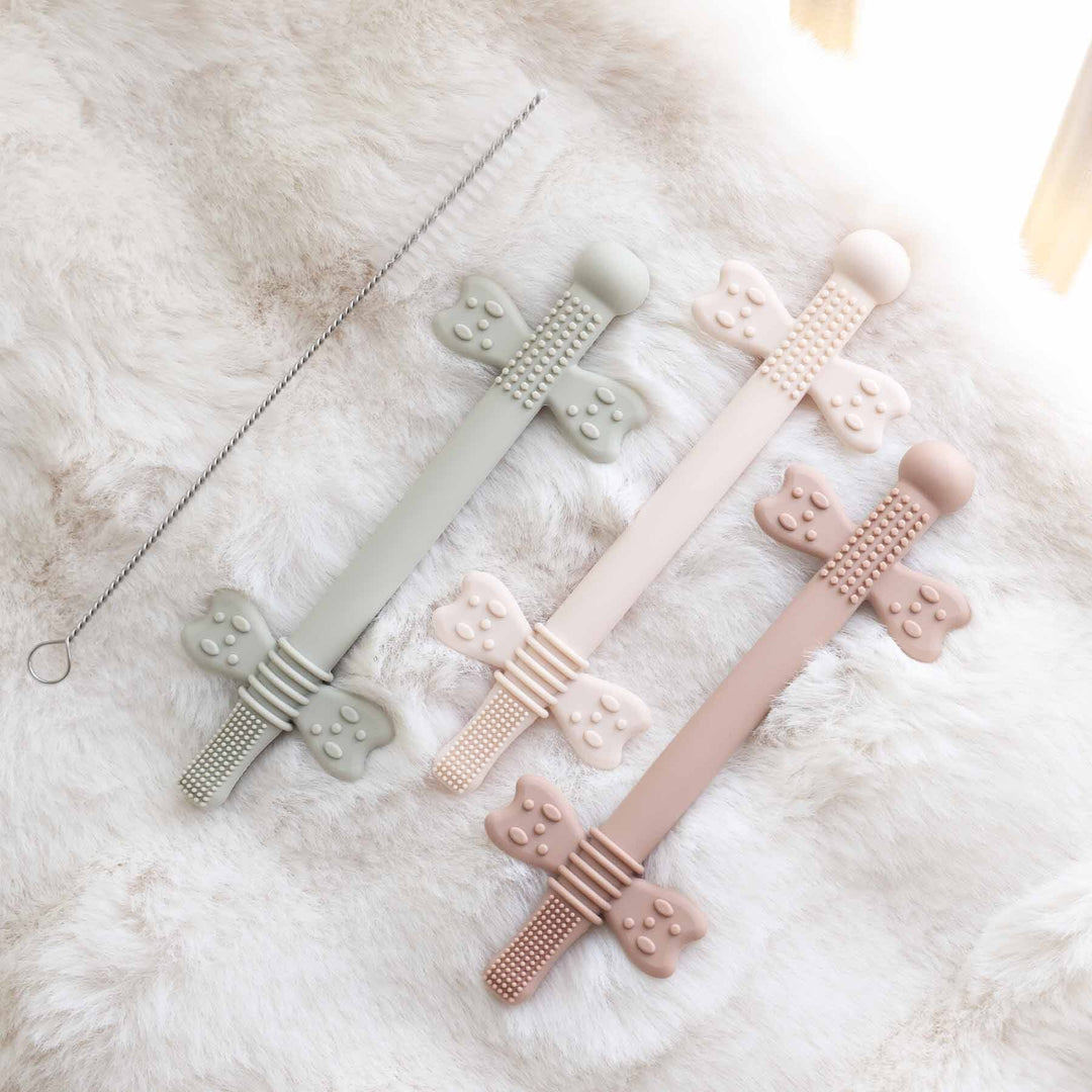 3 pack of neutral colored silicone teething straws with cleaning brush