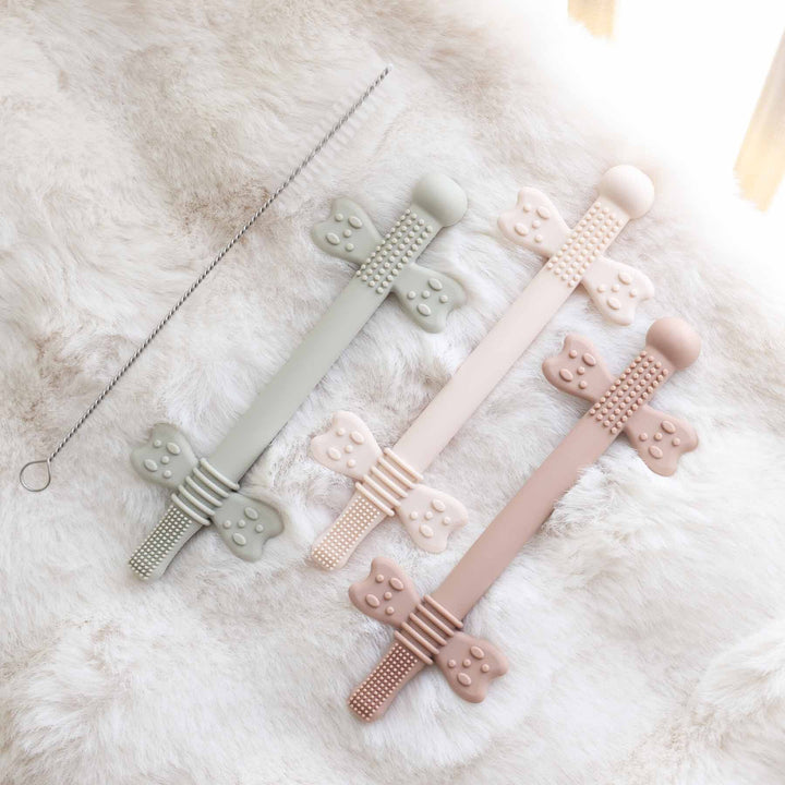 3 pack of neutral colored silicone teething straws with cleaning brush