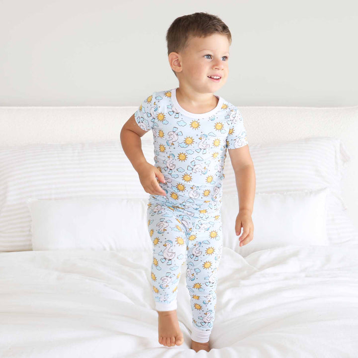 kids two piece pajama set with geese with boots, hat, clouds and suns 