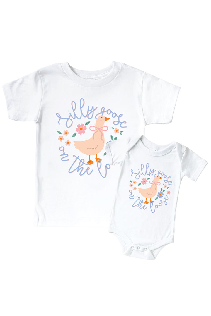 White kids tee and baby bodysuit mockup with Silly Goose On The Loose graphic featuring a goose surrounded by flowers on a white background