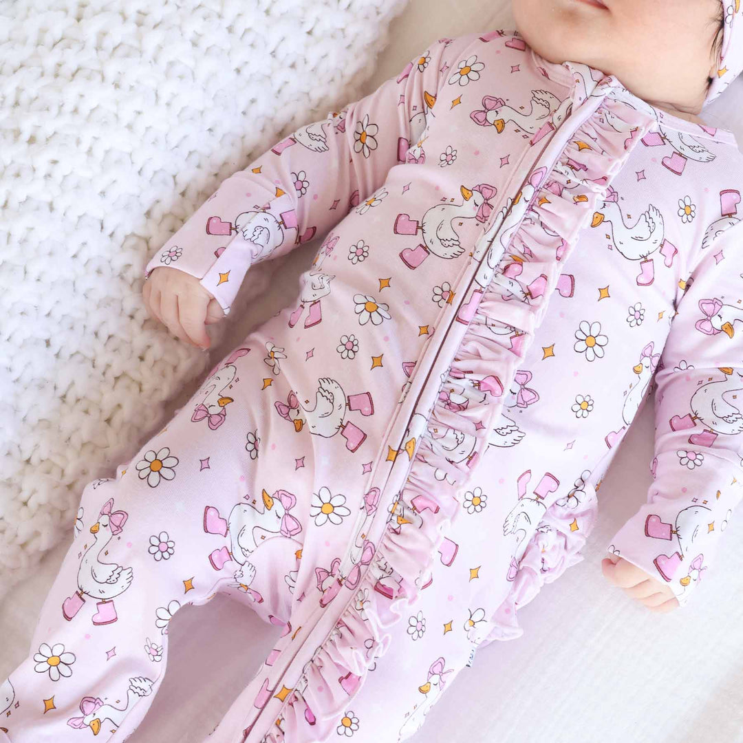 pink goose ruffle zipper footie for girls 