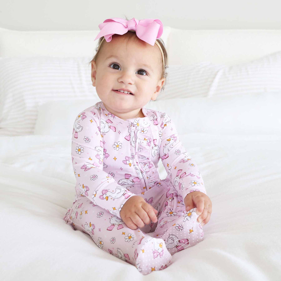 pink goose ruffle zipper footie for baby girls 