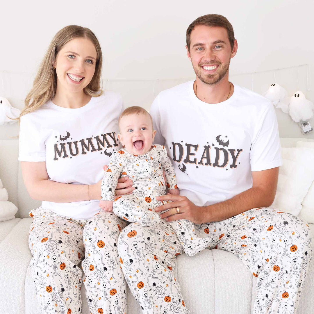 skeleton, spider web, pumpkin and candy corn neutral family matching pajamas 