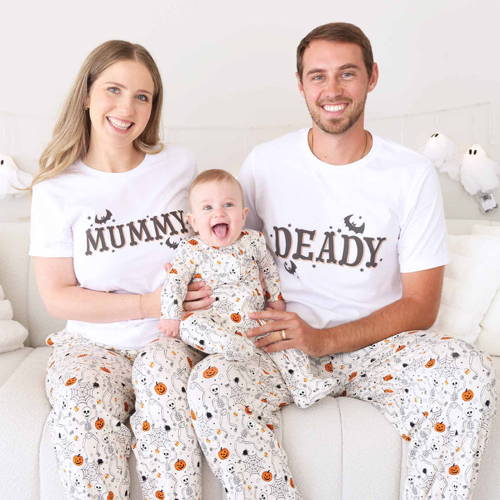 skeleton, spider web, pumpkin and candy corn neutral family matching pajamas 
