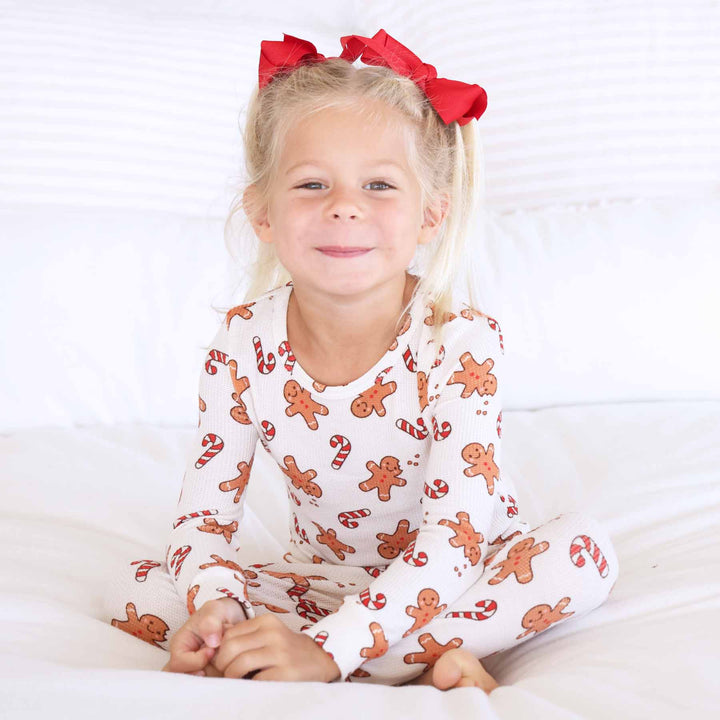 gender neutral christmas pajamas for kids with gingerbread men and candy canes 