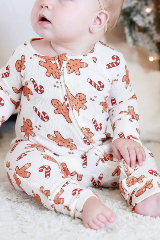 off white background with gingerbread men and candy canes convertible zip romper pajama for babies and toddlers 
