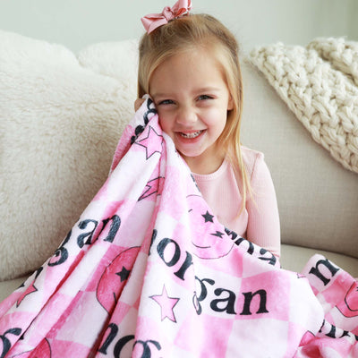 pink personalized kids blanket check with smiley face
