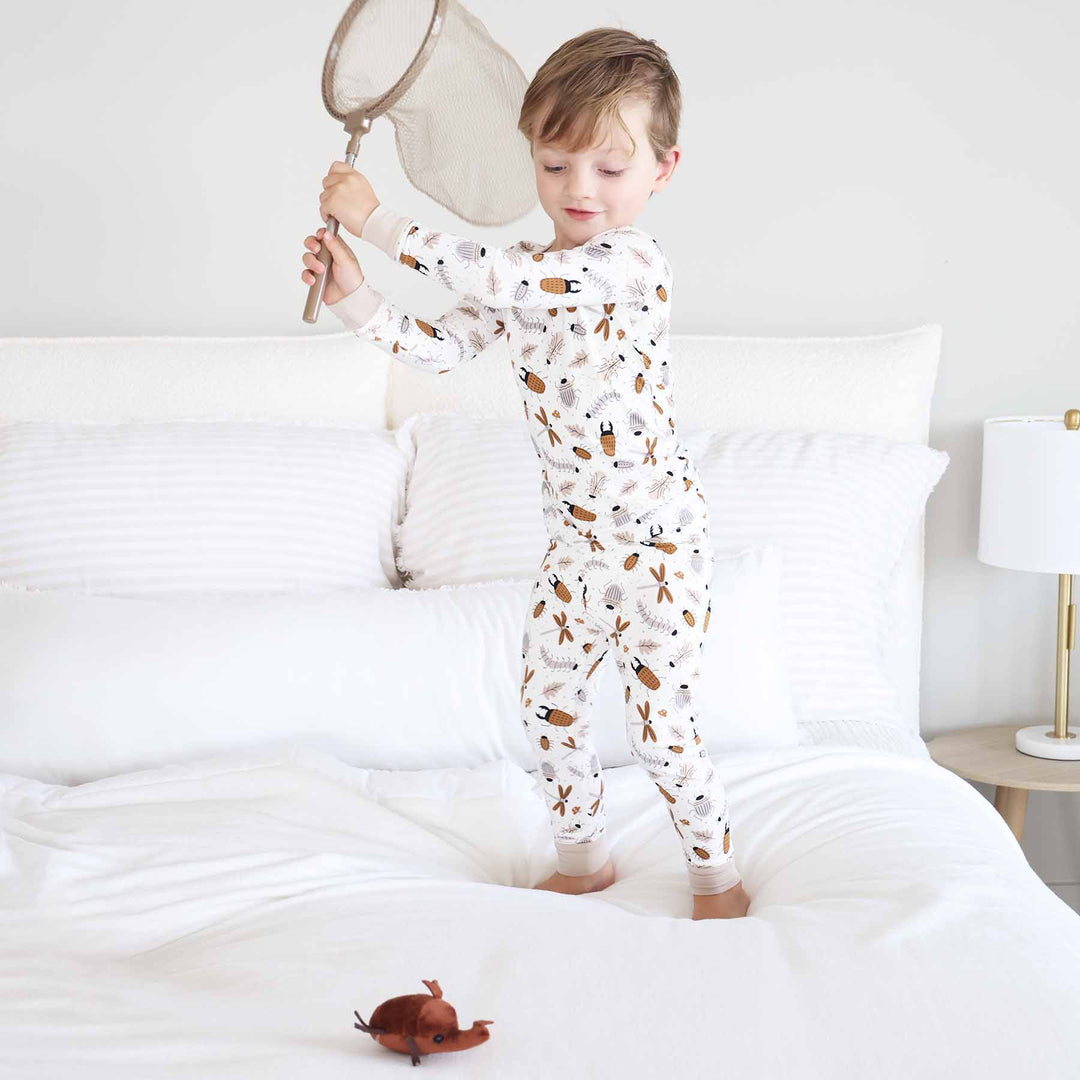 white, brown and taupe neutral bug two piece pajama set for kids 