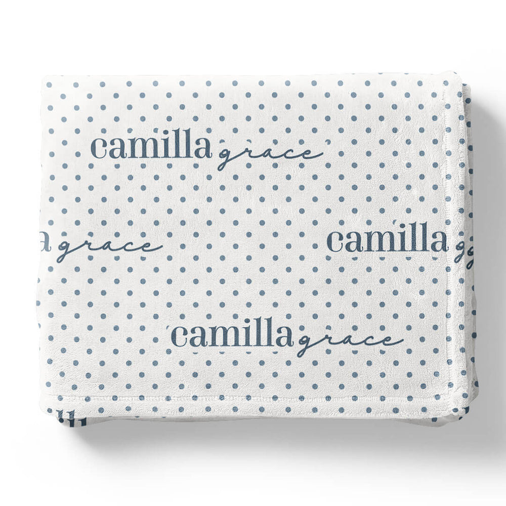 white winky blanket for kids with blue polka dots that is personalized with kids name 