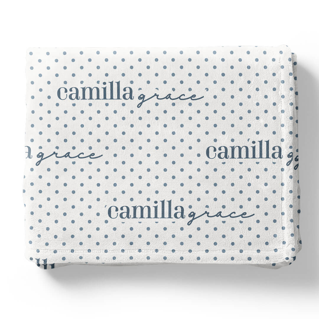 white winky blanket for kids with blue polka dots that is personalized with kids name 
