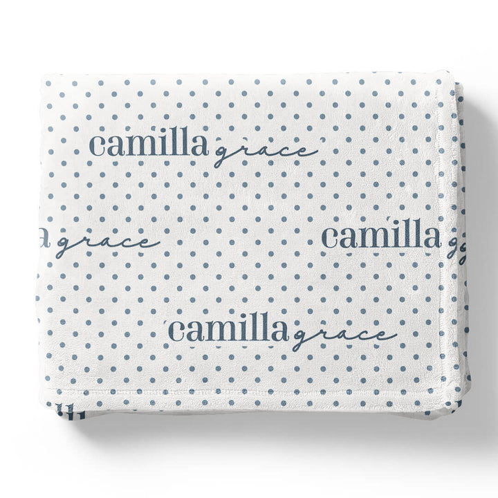 white winky blanket for kids with blue polka dots that is personalized with kids name 