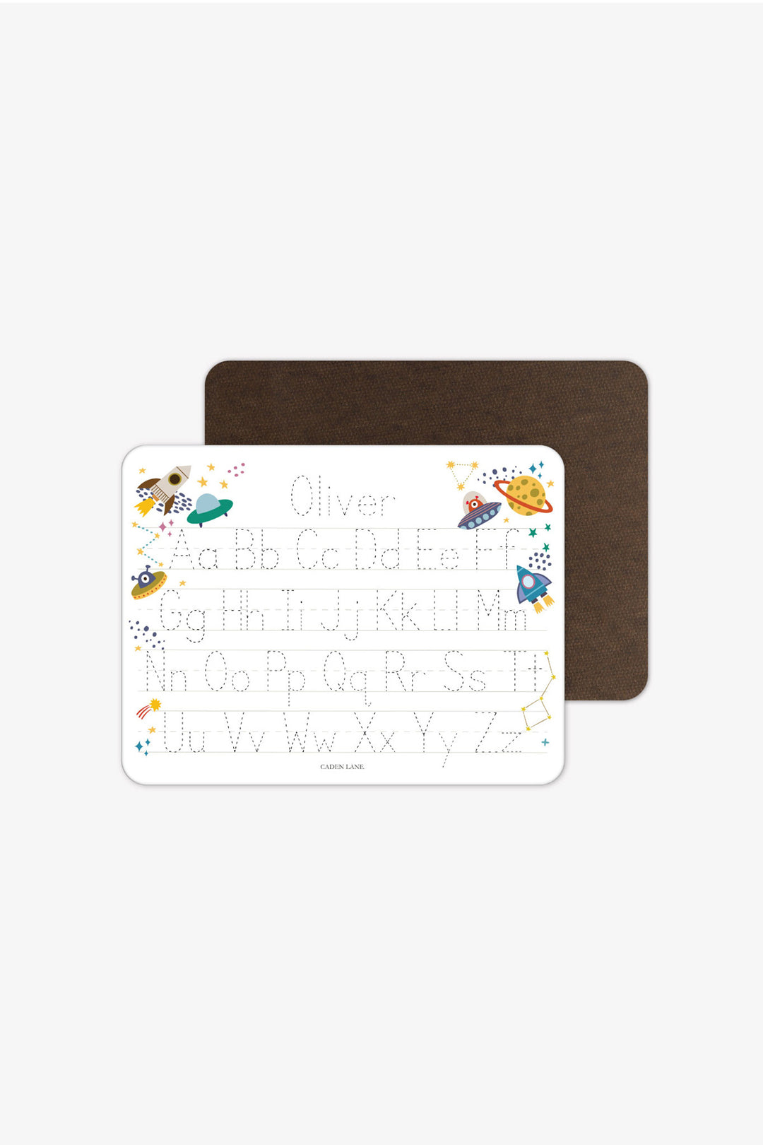 Front and back view of a personalized Caden Lane Star Explorer alphabet whiteboard with dark wood-grain back, showing rockets, UFOs, and planets with tracing letters and custom name