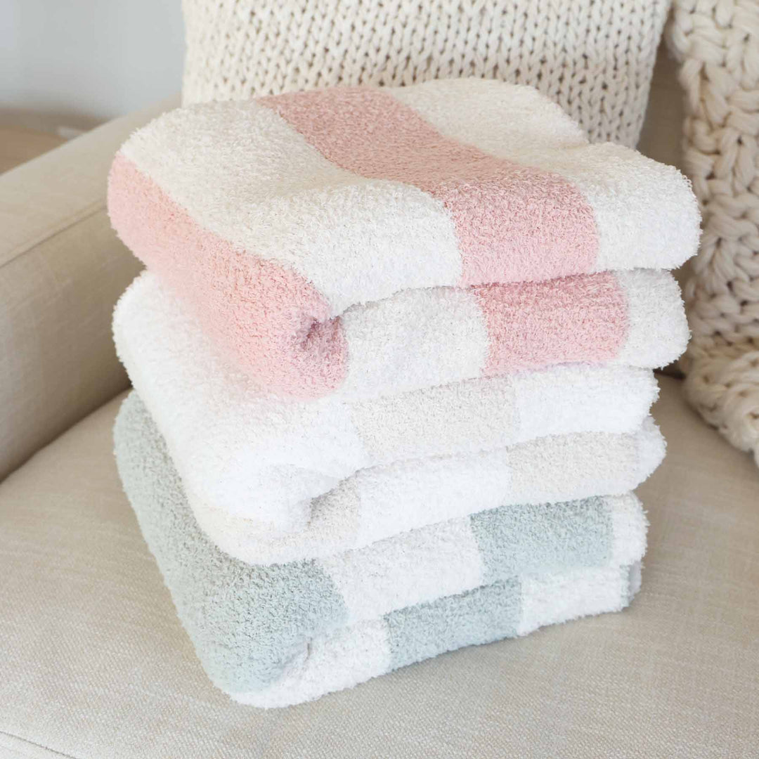 cuddlelane luxe striped collection with pink, sage and neutral microfiber blankets 