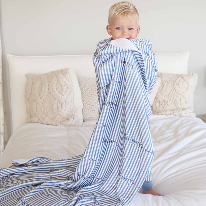 boy wrapped in blue and white stripe personalized blanket for kids 