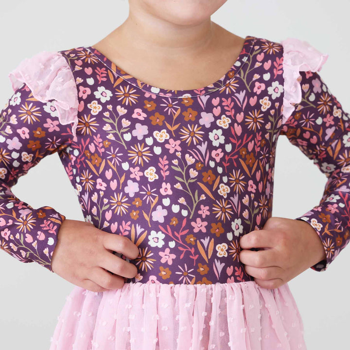 purple long sleeve leotard for girls with pink and orange floral with light pink tulle shoulder detailing and pink tulle skirt 