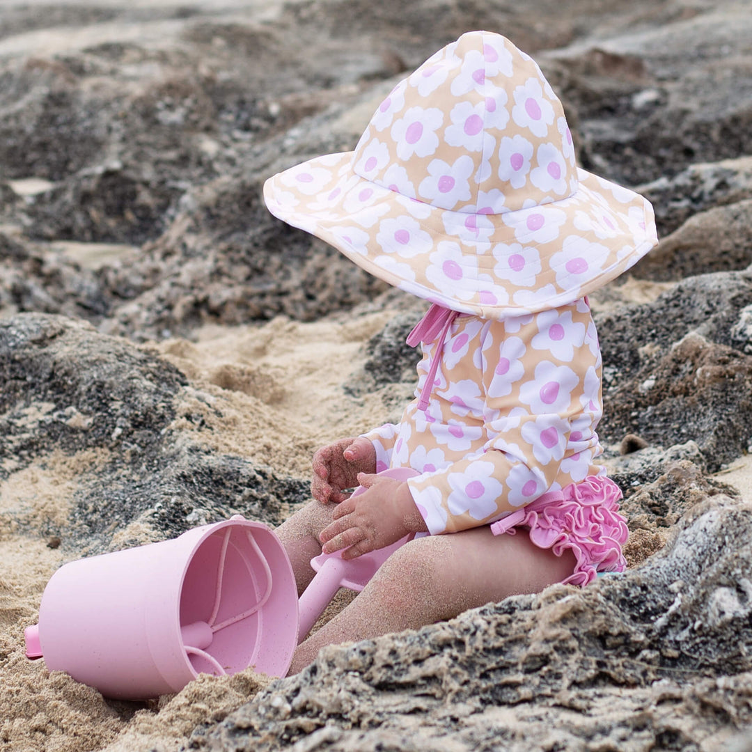 long sleeve rash guard shirt with ruffle bottom pink and yellow daisy 