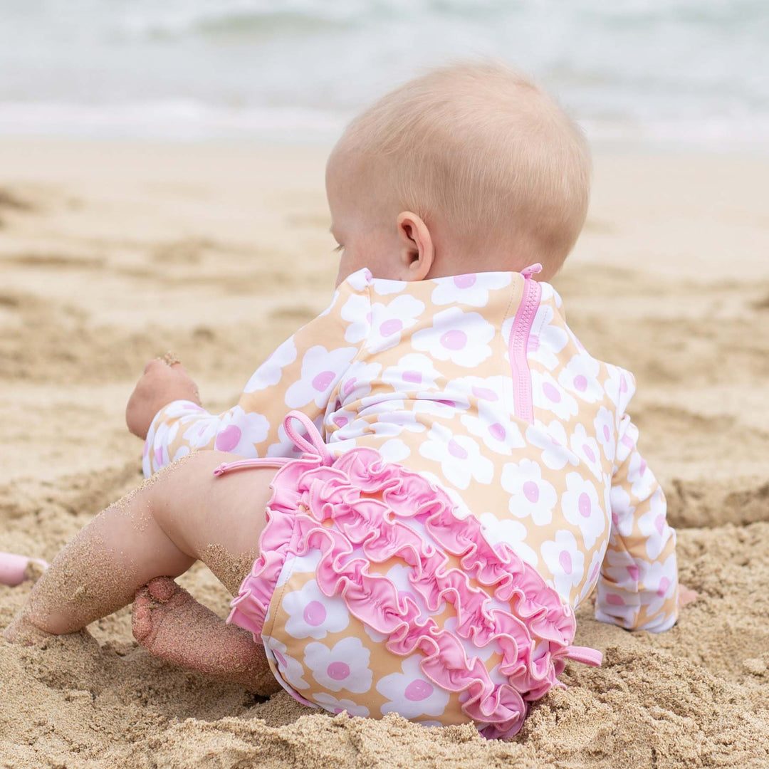 pink and yellow daisy long sleeve rash guard shirt with ruffle bottom 