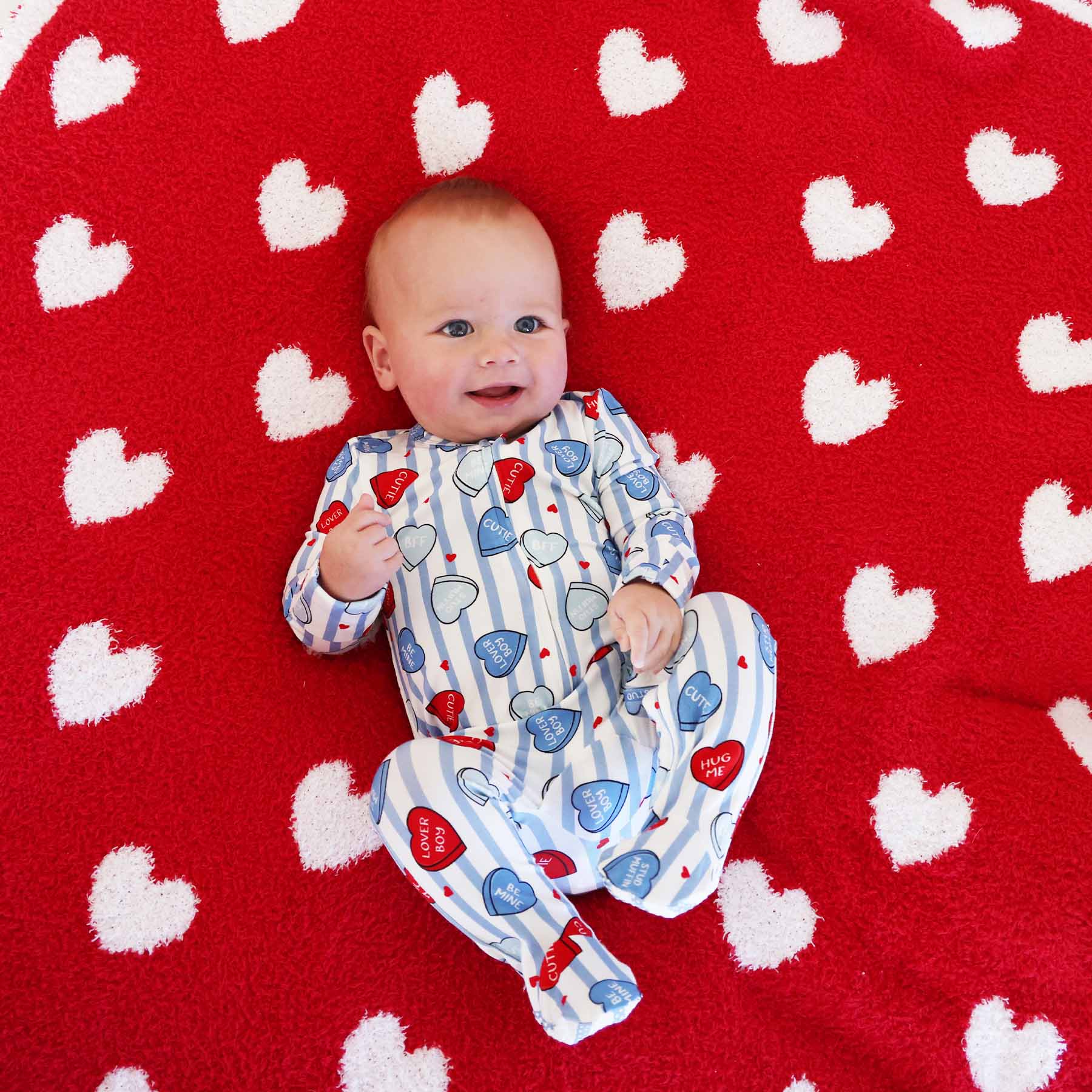 valentine's day heart footie pajama for baby boys with a coordinating red heart plush blanket 