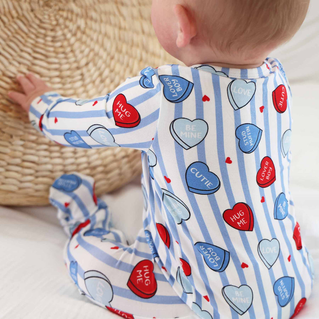 closeup of candy heart baby footie pajama for boys 