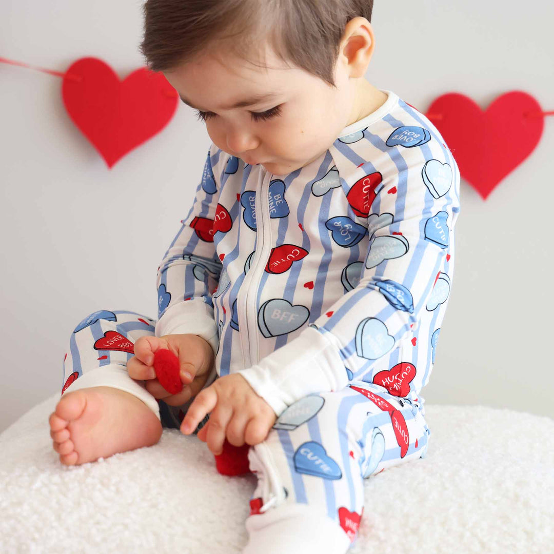 valentine's day baby zip romper with blue stripes and conversation hearts 