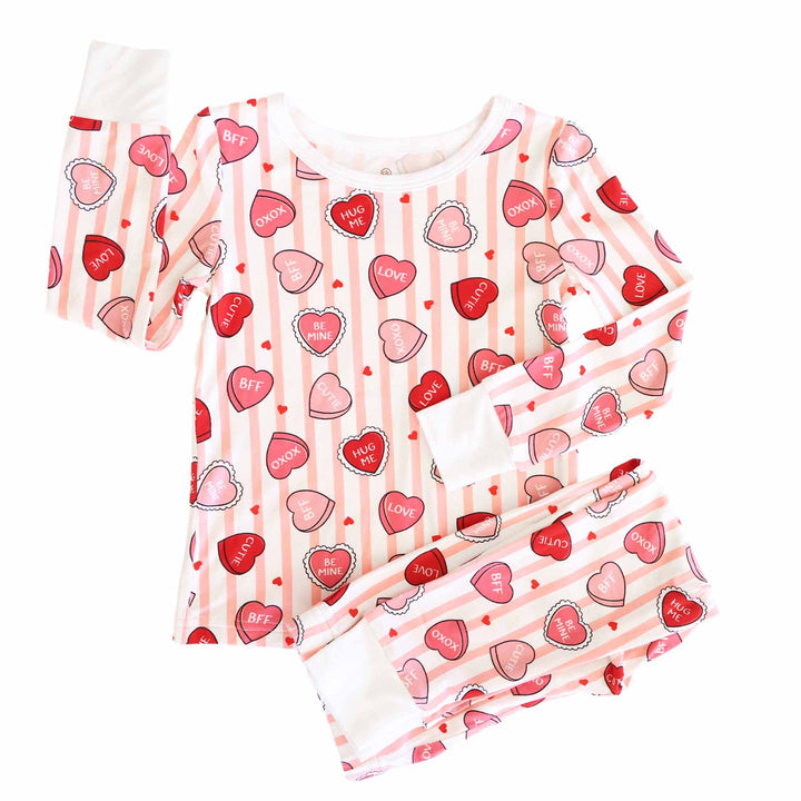 girl's pink stripe and candy heart two piece valentine's day pajama set for kids 
