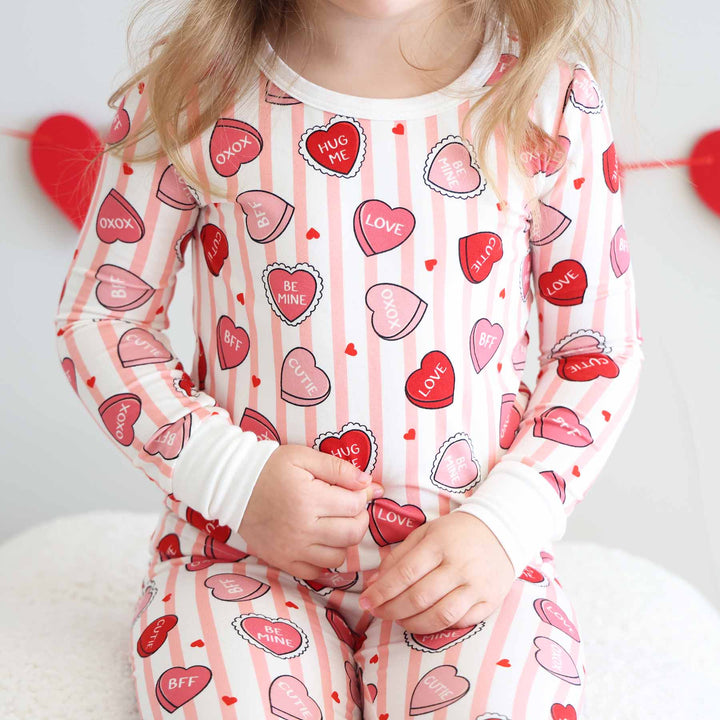 pink stripe and conversation heart girl's two piece pajama set for valentine's day 