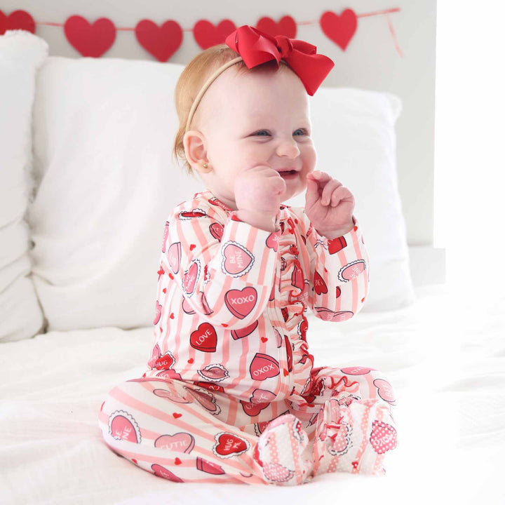 pink stripe conversation heart and stripe ruffle zipper footie with red trim 