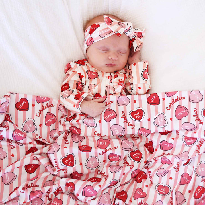 sweet like candy personalized swaddle blanket in pink with matching footie 