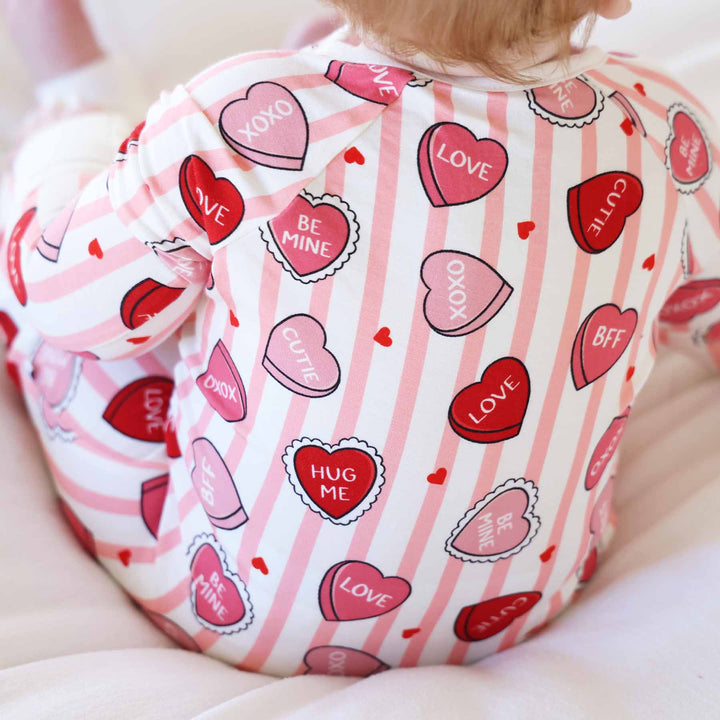 closeup of sweet like candy pink convertible zip romper for babies and toddlers 